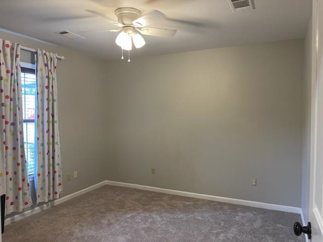238 Wolf Ridge Cove Collierville, TN 38017 - Photo 22 of 25 an empty room with windows and fan