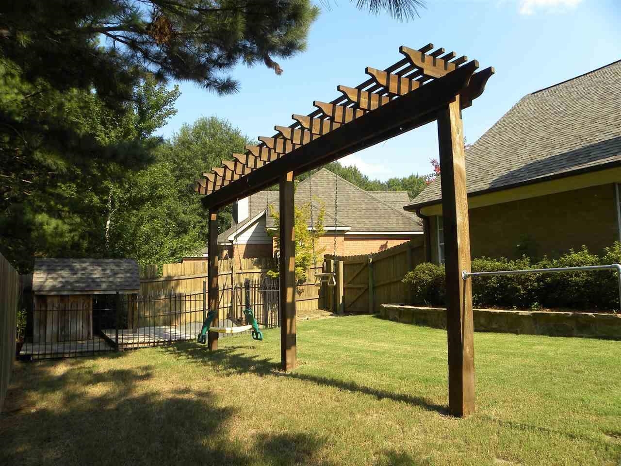 238 Wolf Ridge Cove Collierville, TN 38017 - Photo 24 of 25 a view of a house with a yard