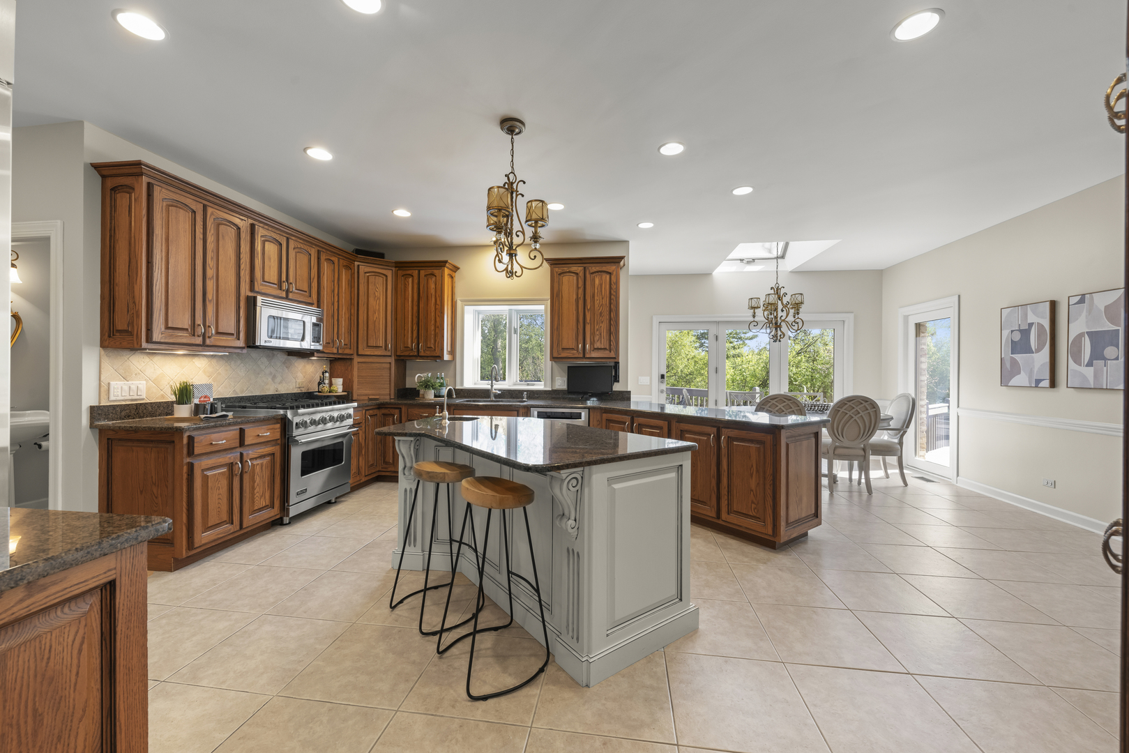 1S151 Winfield Road Wheaton, IL 60189 - Photo 18 of 73 a kitchen with granite countertop lots of counter top space and stainless steel appliances