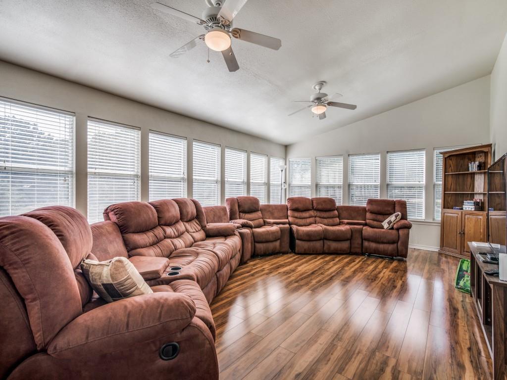 233 Esquire Estates Road Mabank, TX 75156 - Photo 13 of 34 Living area featuring lofted ceiling, wood finished floors, and ceiling fan