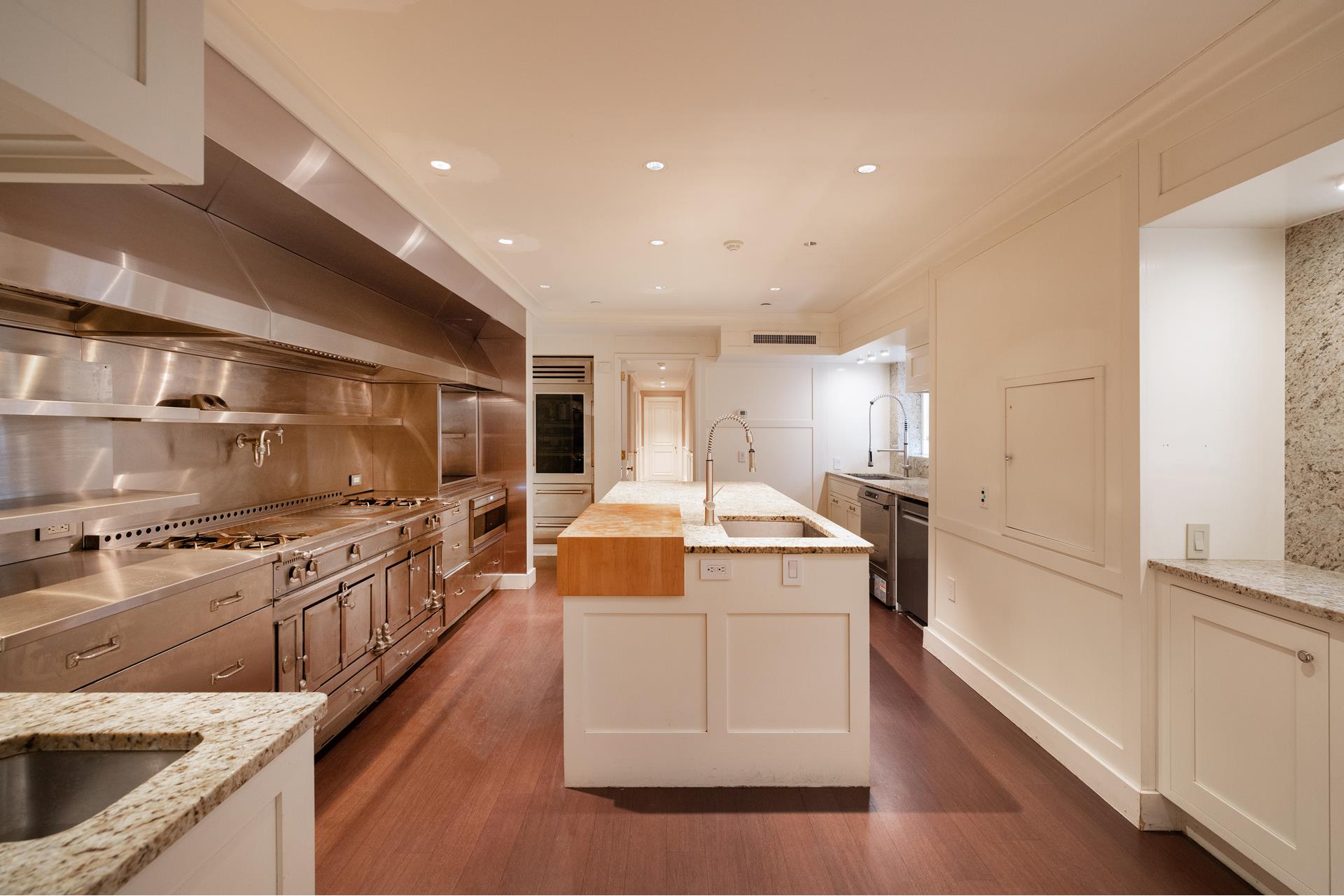 7 Sutton Square Manhattan, NY 10022 - Photo 23 of 30 a kitchen with granite countertop a sink and stainless steel appliances