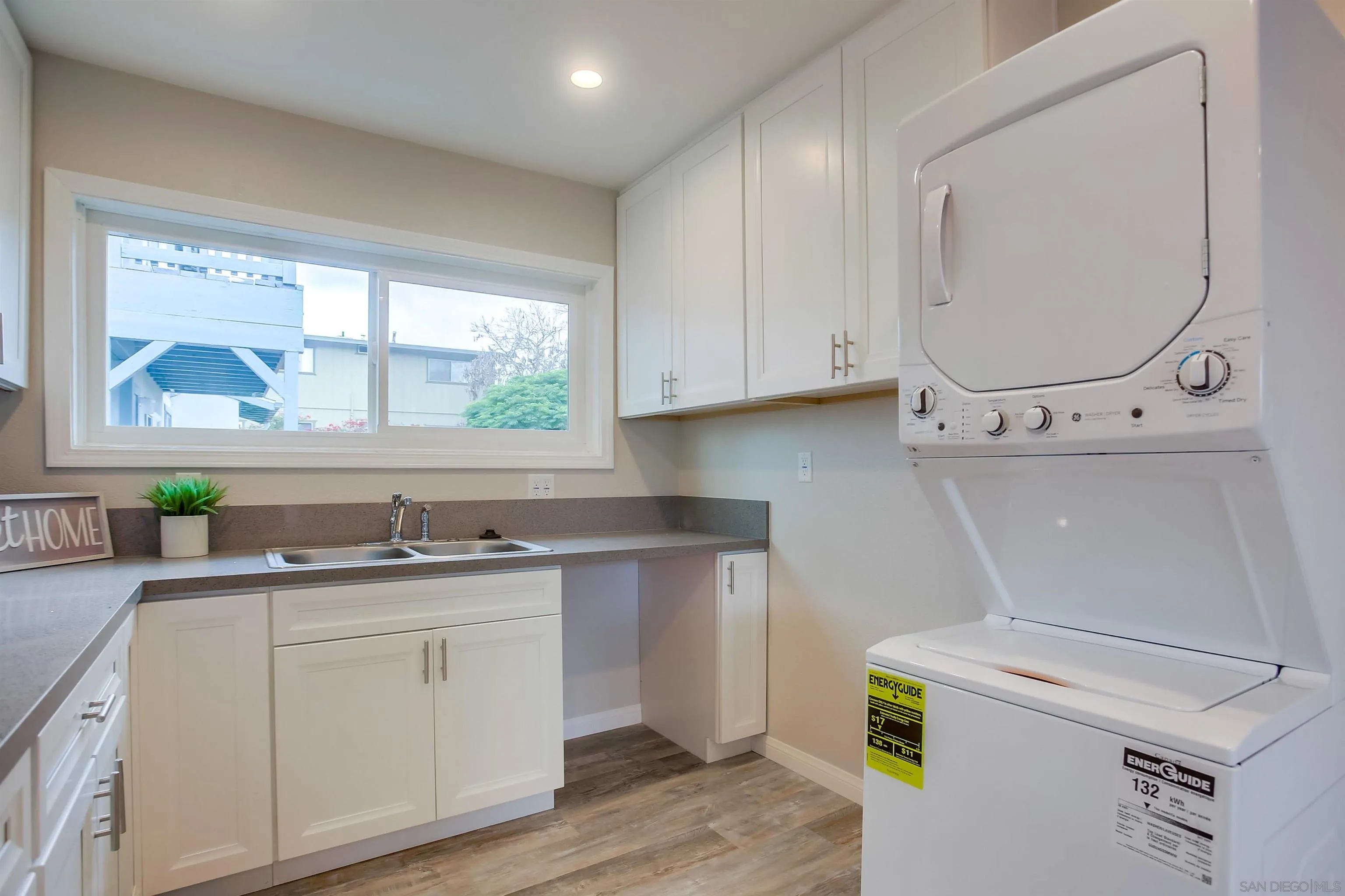 1053 Old Stage Road Fallbrook, CA 92028 - Photo 4 of 21 a utility room with cabinets washer and dryer
