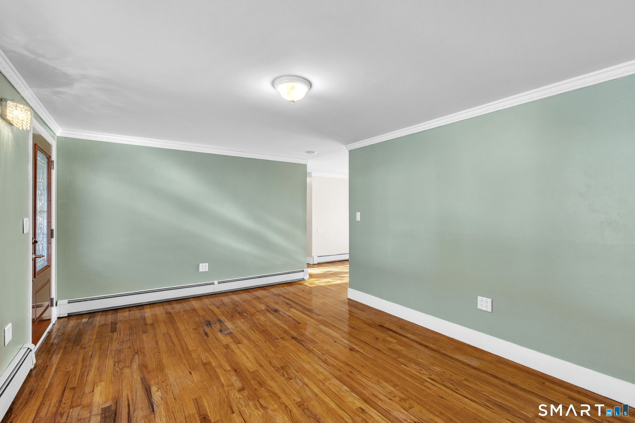 9 Carney Road Enfield, CT 06082 - Photo 16 of 40 a view of an empty room with wooden floor