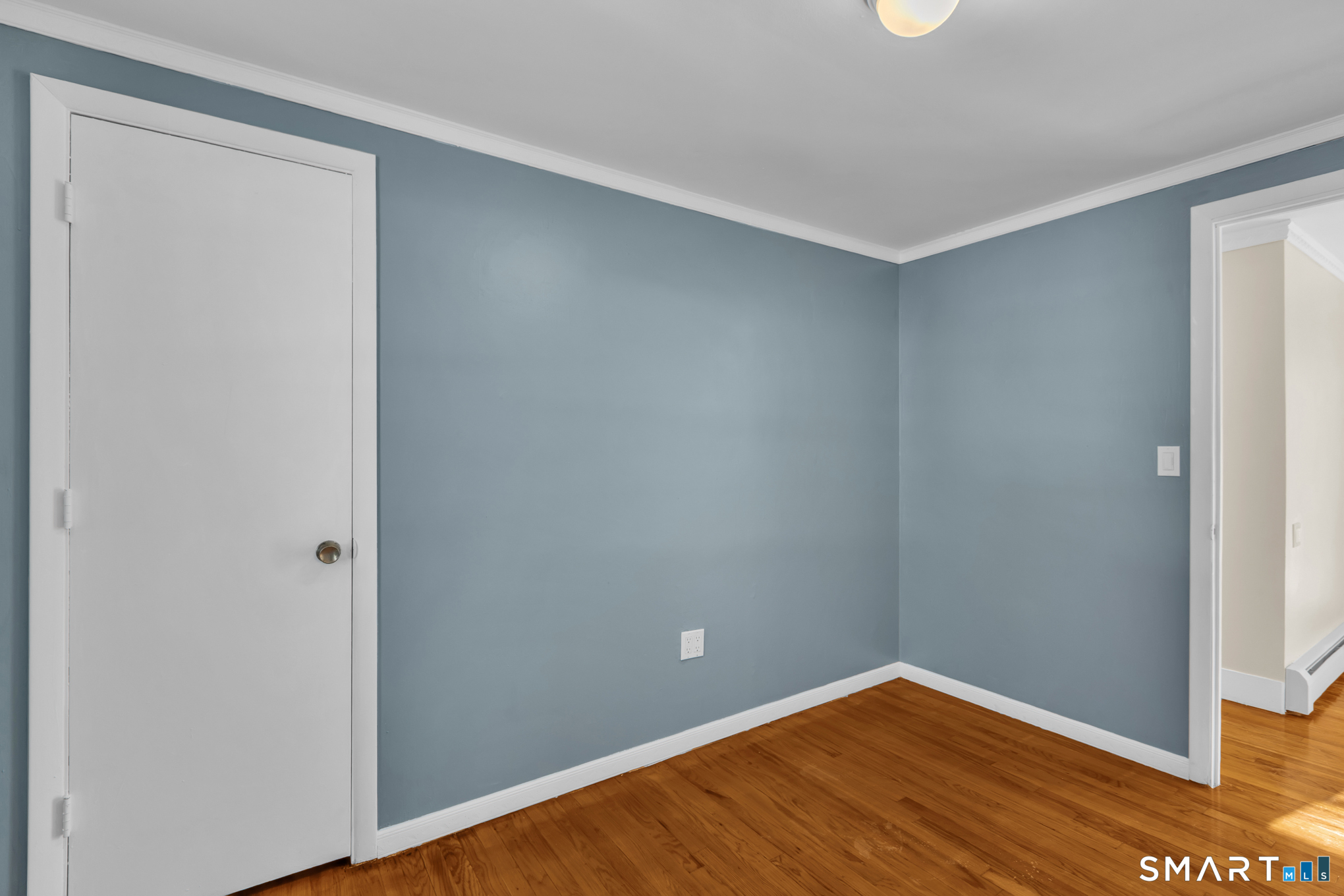 9 Carney Road Enfield, CT 06082 - Photo 19 of 40 a view of an empty room with wooden floor