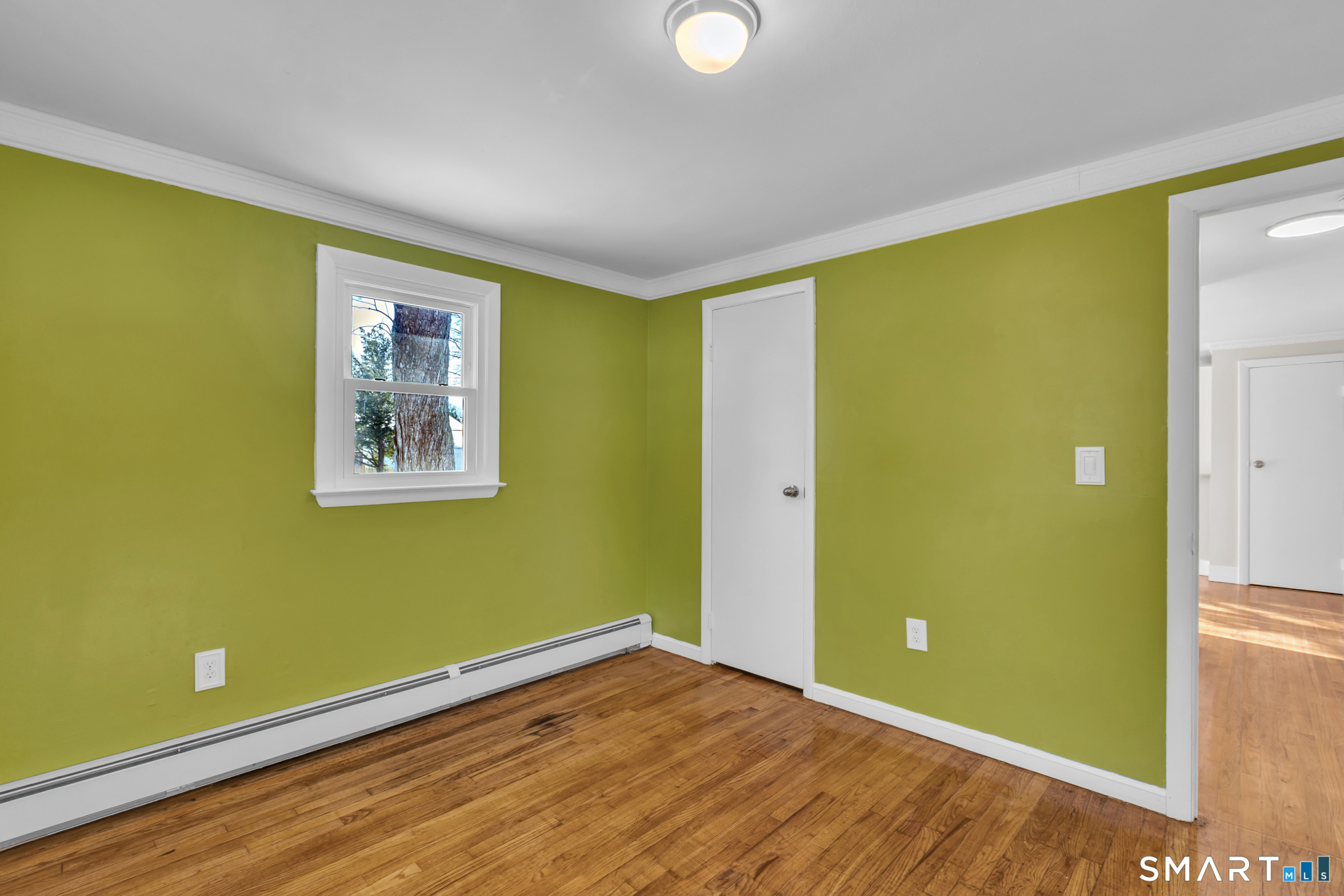 9 Carney Road Enfield, CT 06082 - Photo 22 of 40 a view of empty room with wooden floor