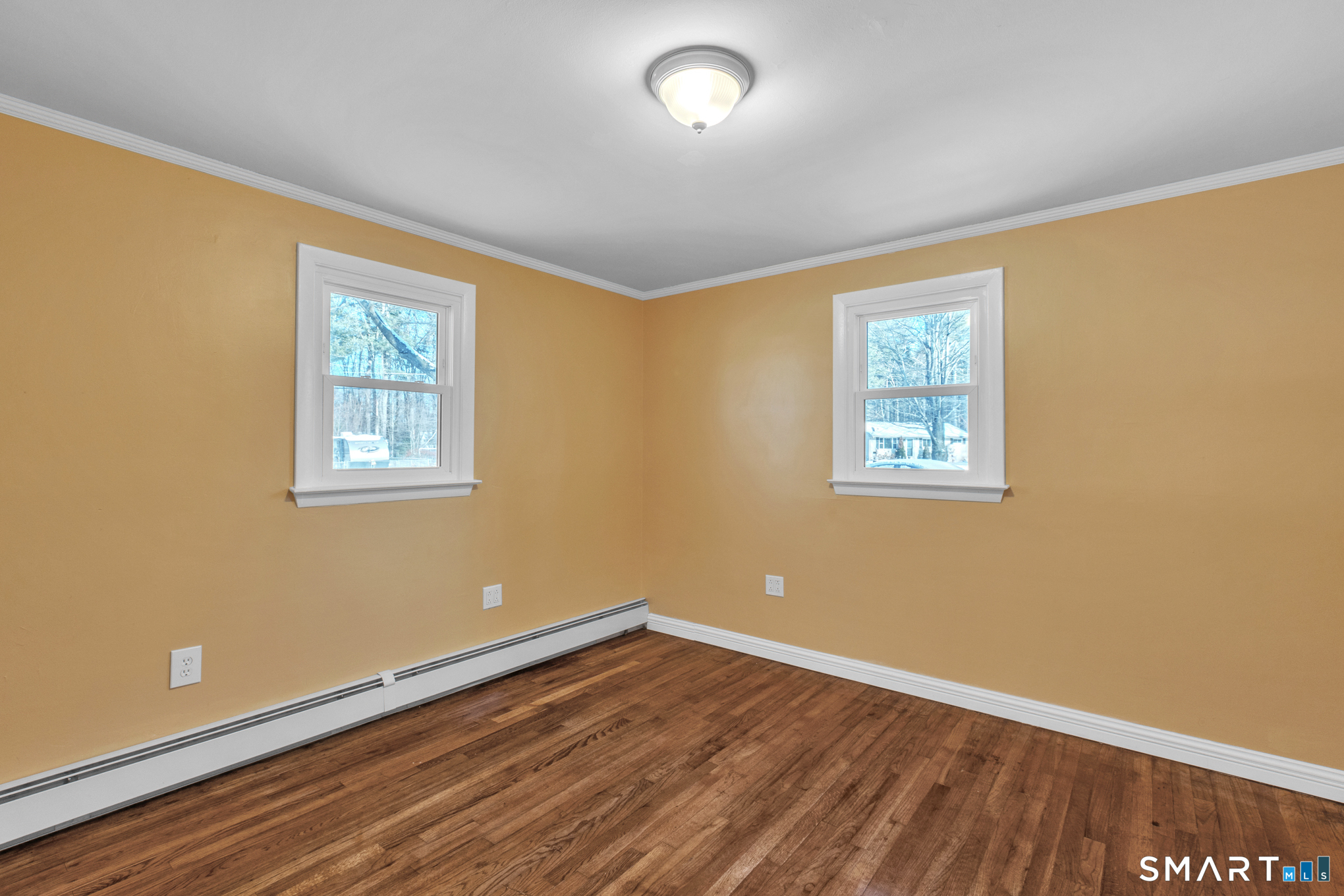 9 Carney Road Enfield, CT 06082 - Photo 24 of 40 a view of a room with wooden floor and windows