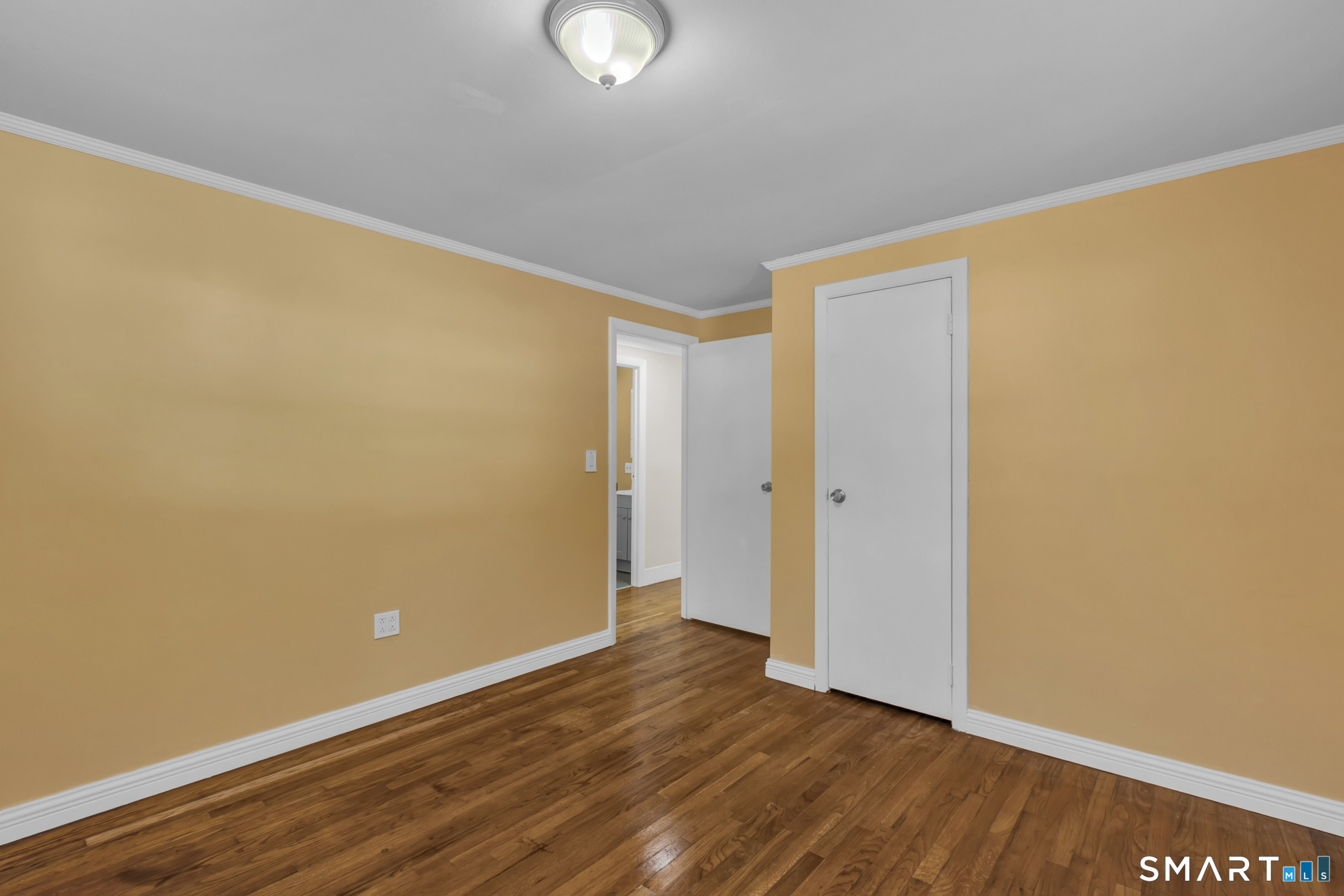 9 Carney Road Enfield, CT 06082 - Photo 26 of 40 a view of an empty room with wooden floor