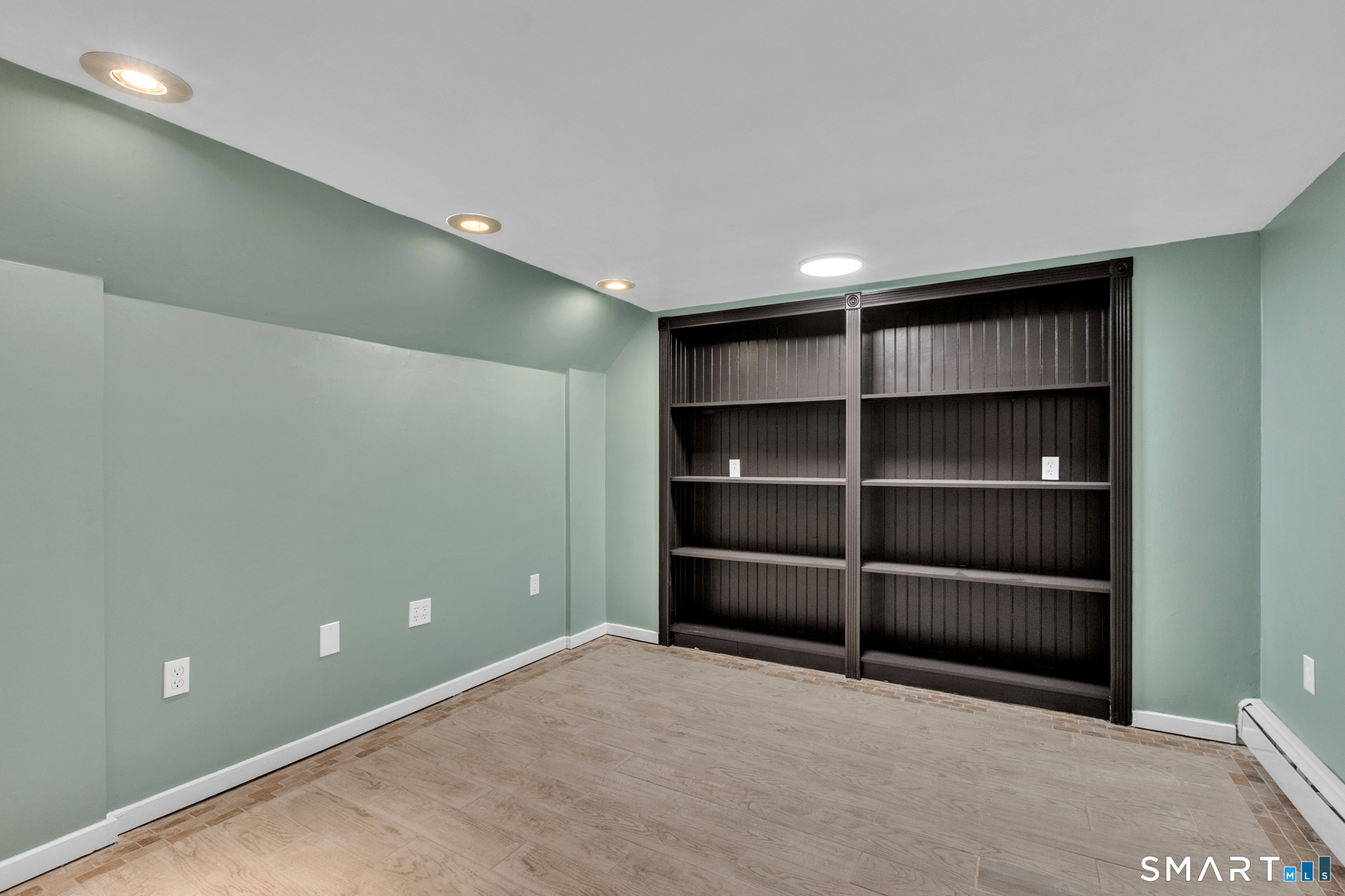 9 Carney Road Enfield, CT 06082 - Photo 29 of 40 a view of an empty room with empty shelves