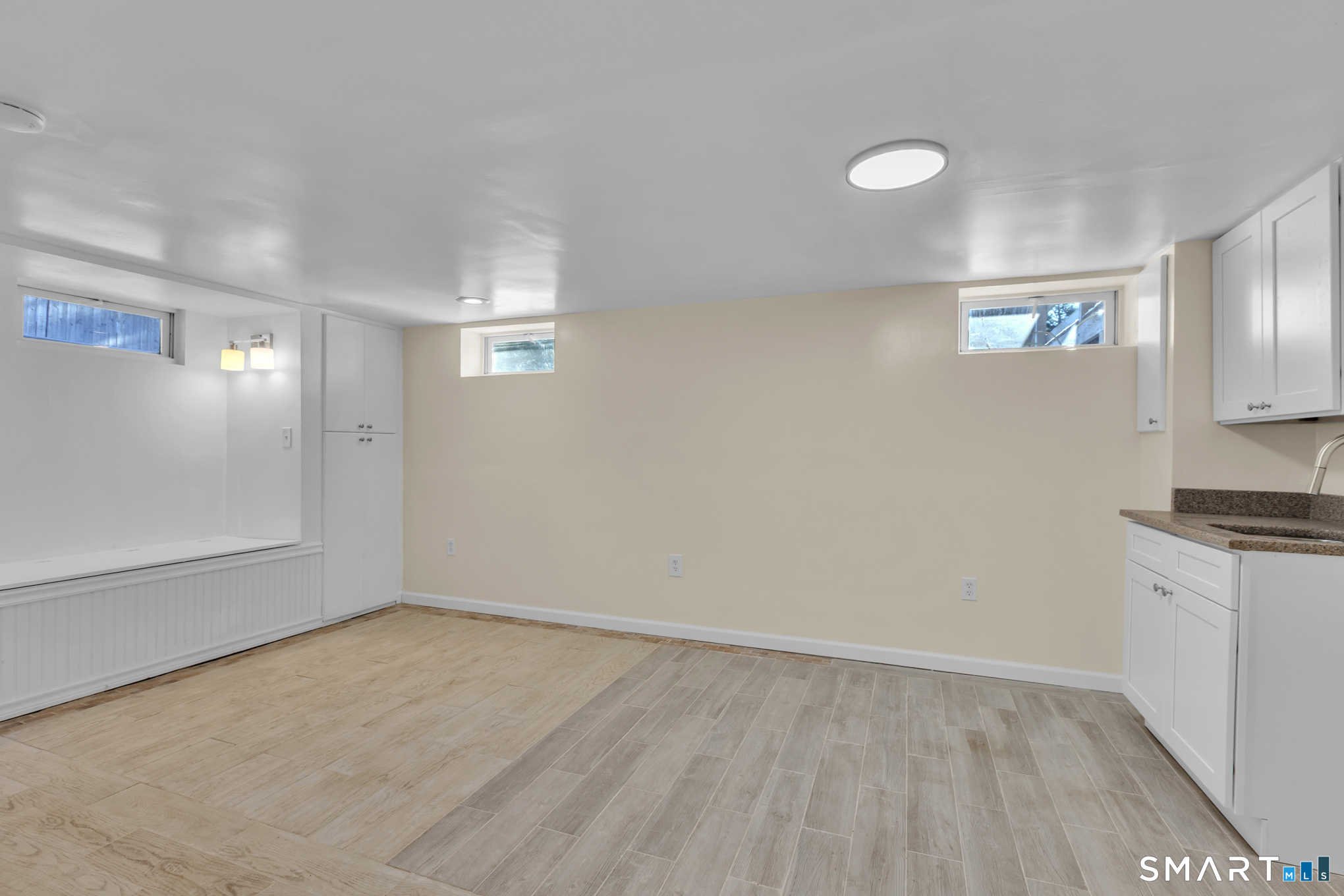 9 Carney Road Enfield, CT 06082 - Photo 33 of 40 a view of a kitchen with a sink cabinets and wooden floor