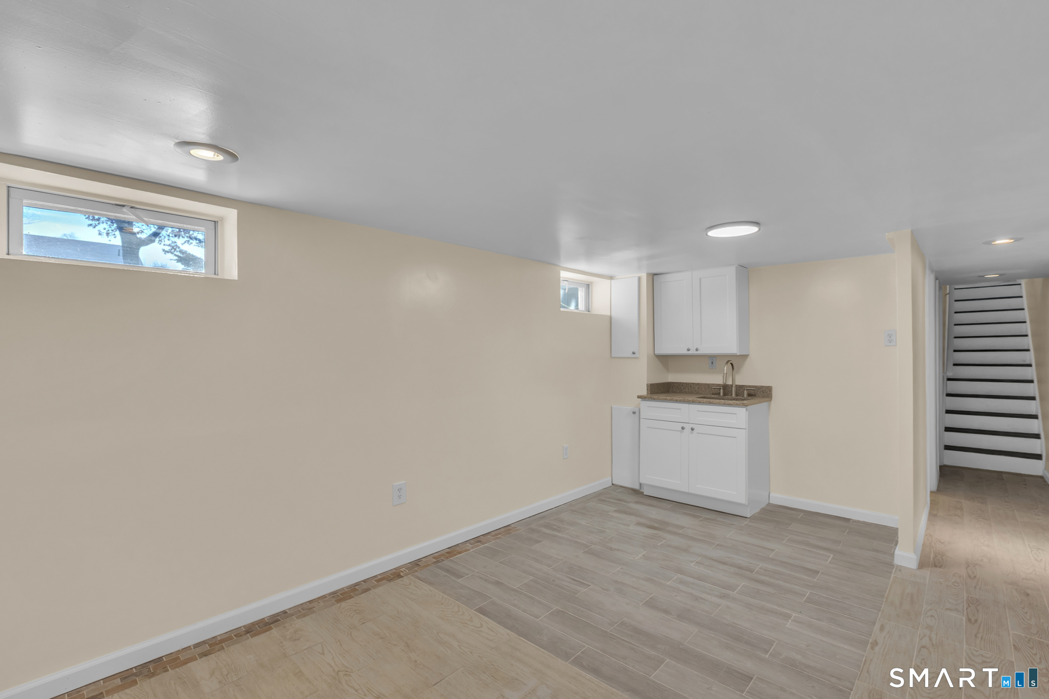 9 Carney Road Enfield, CT 06082 - Photo 34 of 40 a view of a kitchen with wooden floor and a sink