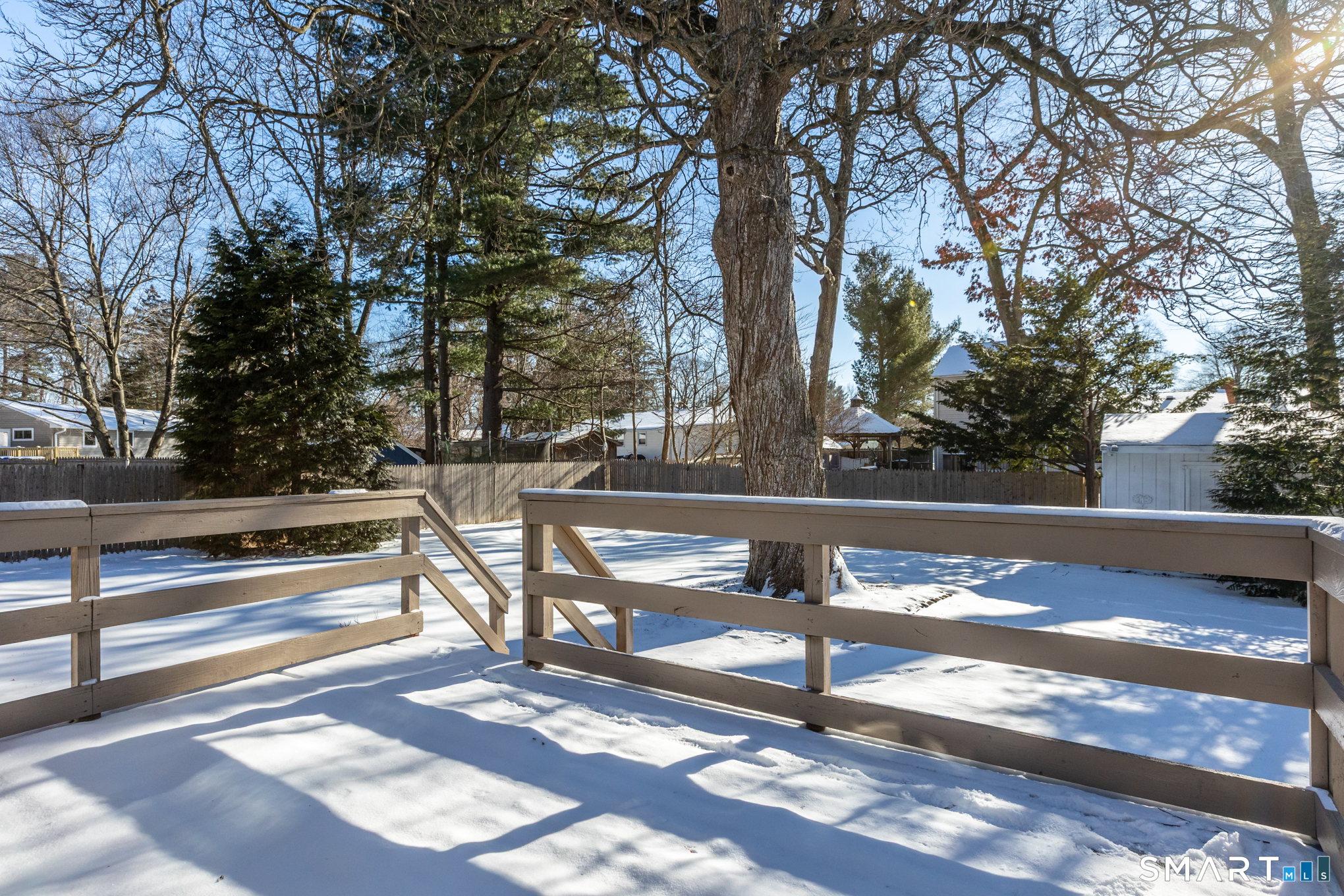 9 Carney Road Enfield, CT 06082 - Photo 38 of 40 a view of backyard with wooden fence and large trees