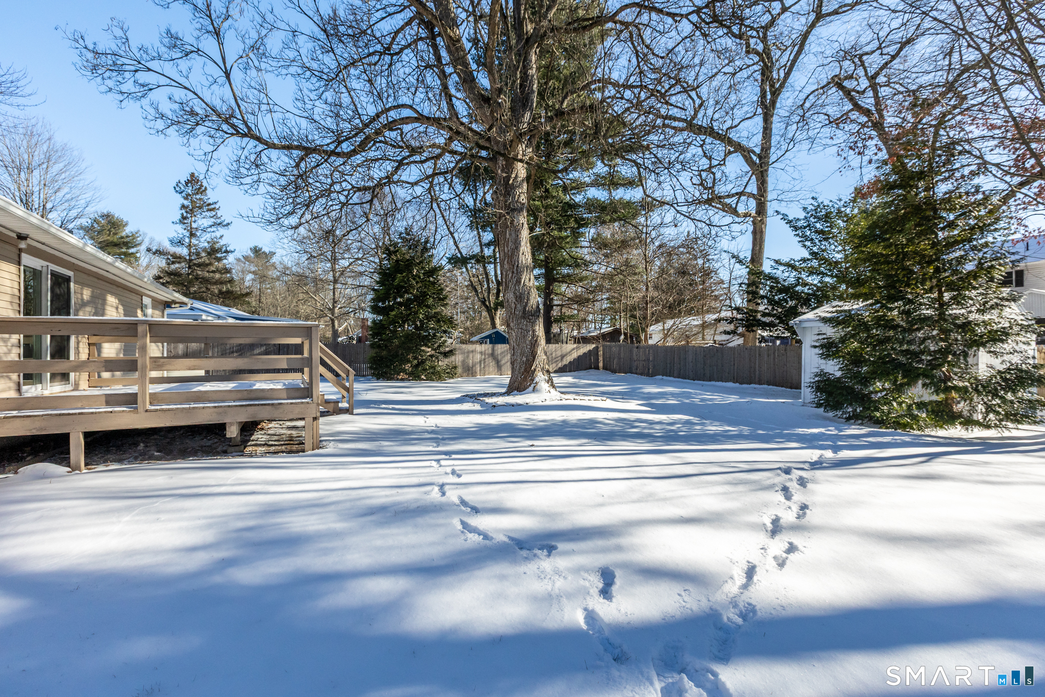 9 Carney Road Enfield, CT 06082 - Photo 39 of 40 a view of backyard with wooden stairs and a patio