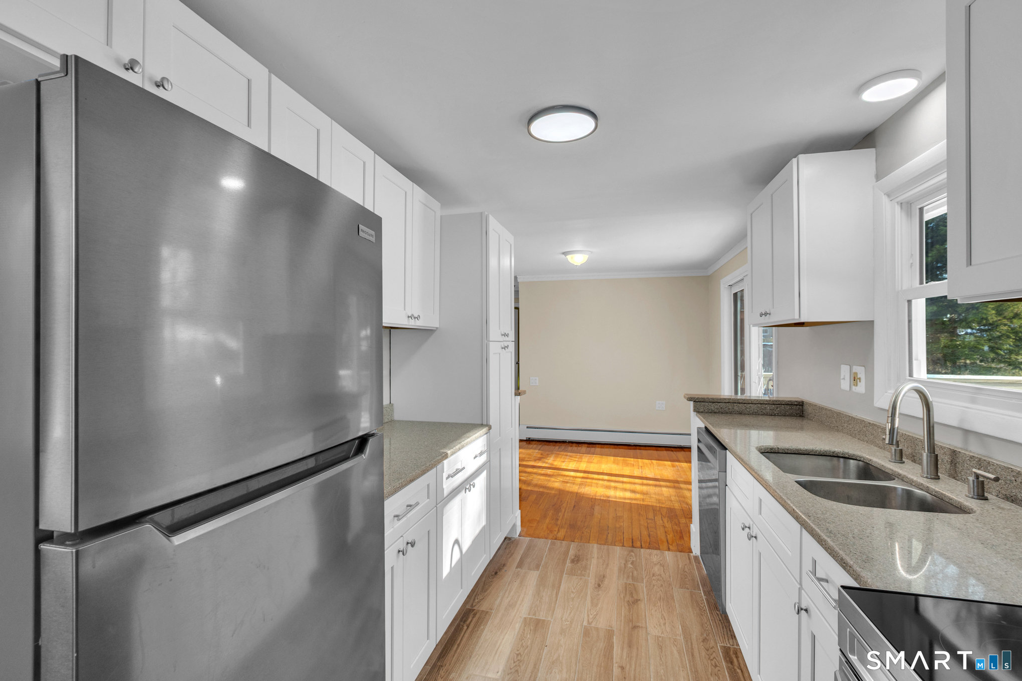 9 Carney Road Enfield, CT 06082 - Photo 5 of 40 a kitchen with stainless steel appliances granite countertop a refrigerator a sink and a stove
