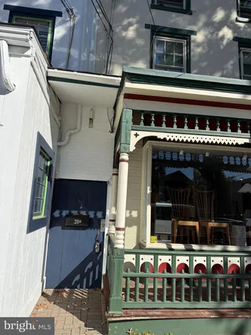 a view of house with a door and wooden floor
