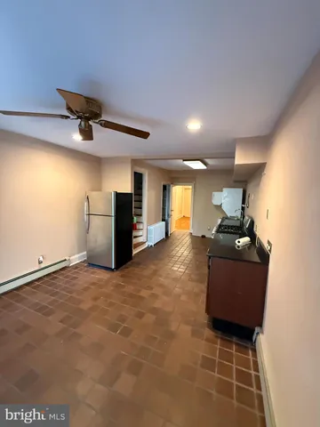 a view of bedroom with wooden floor and stairs