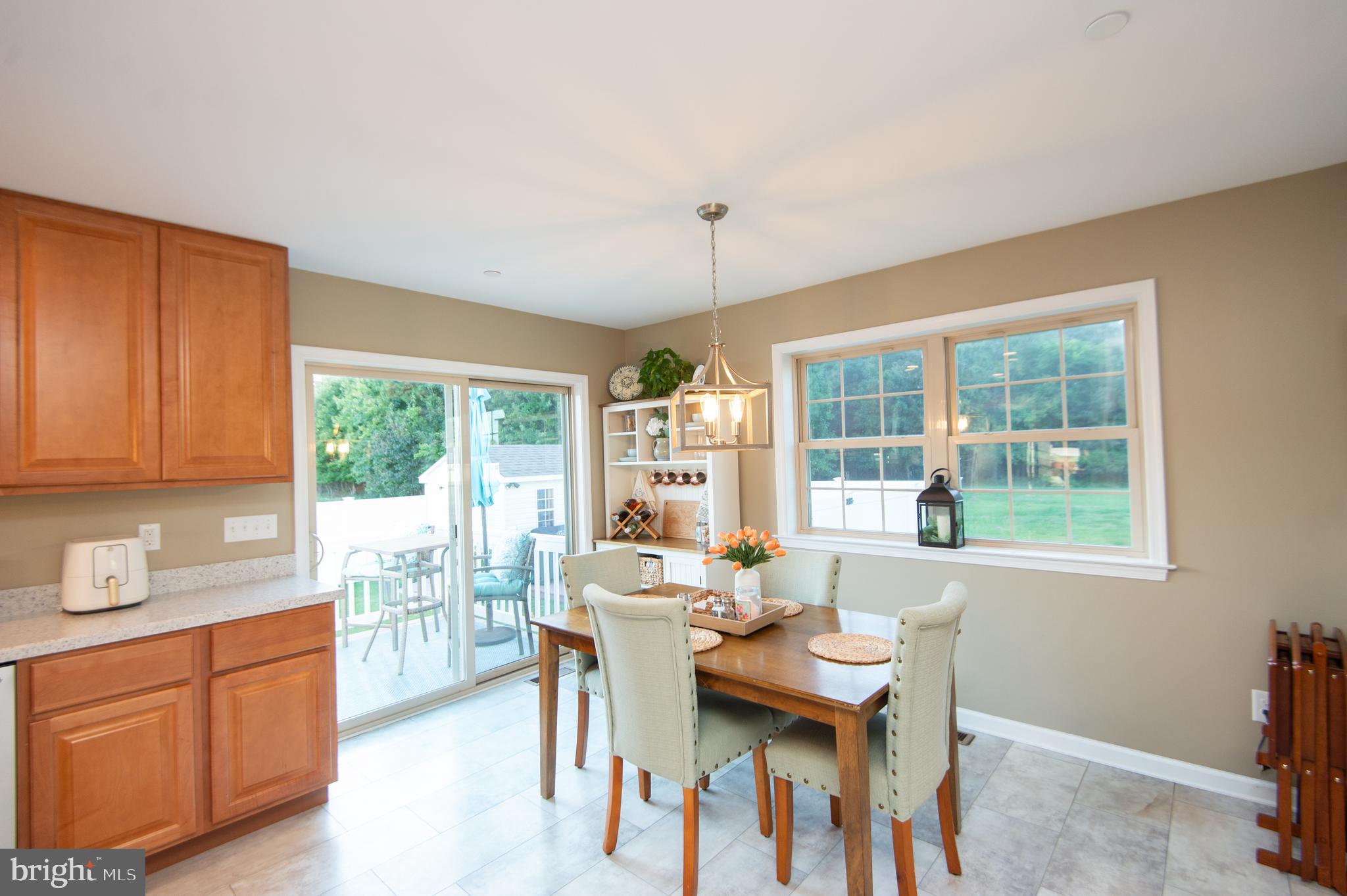 2 Arbutus Terrace Cambridge, MD 21613 - Photo 11 of 41 a dining room with furniture a chandelier and wooden floor