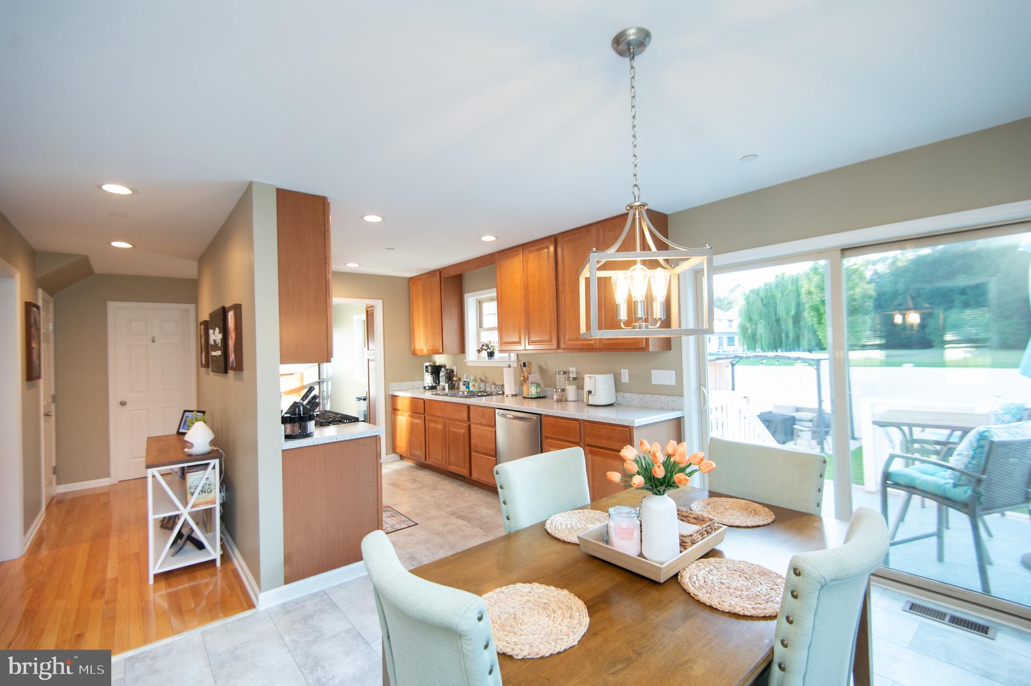 2 Arbutus Terrace Cambridge, MD 21613 - Photo 12 of 41 a living room with furniture a large window and kitchen view
