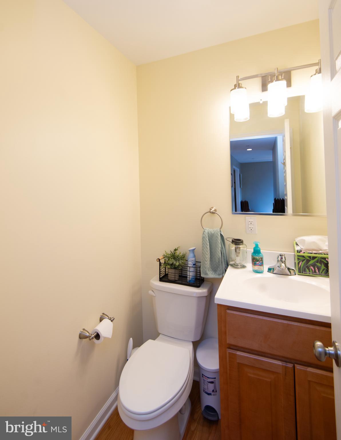 2 Arbutus Terrace Cambridge, MD 21613 - Photo 20 of 41 a bathroom with a toilet a sink and mirror