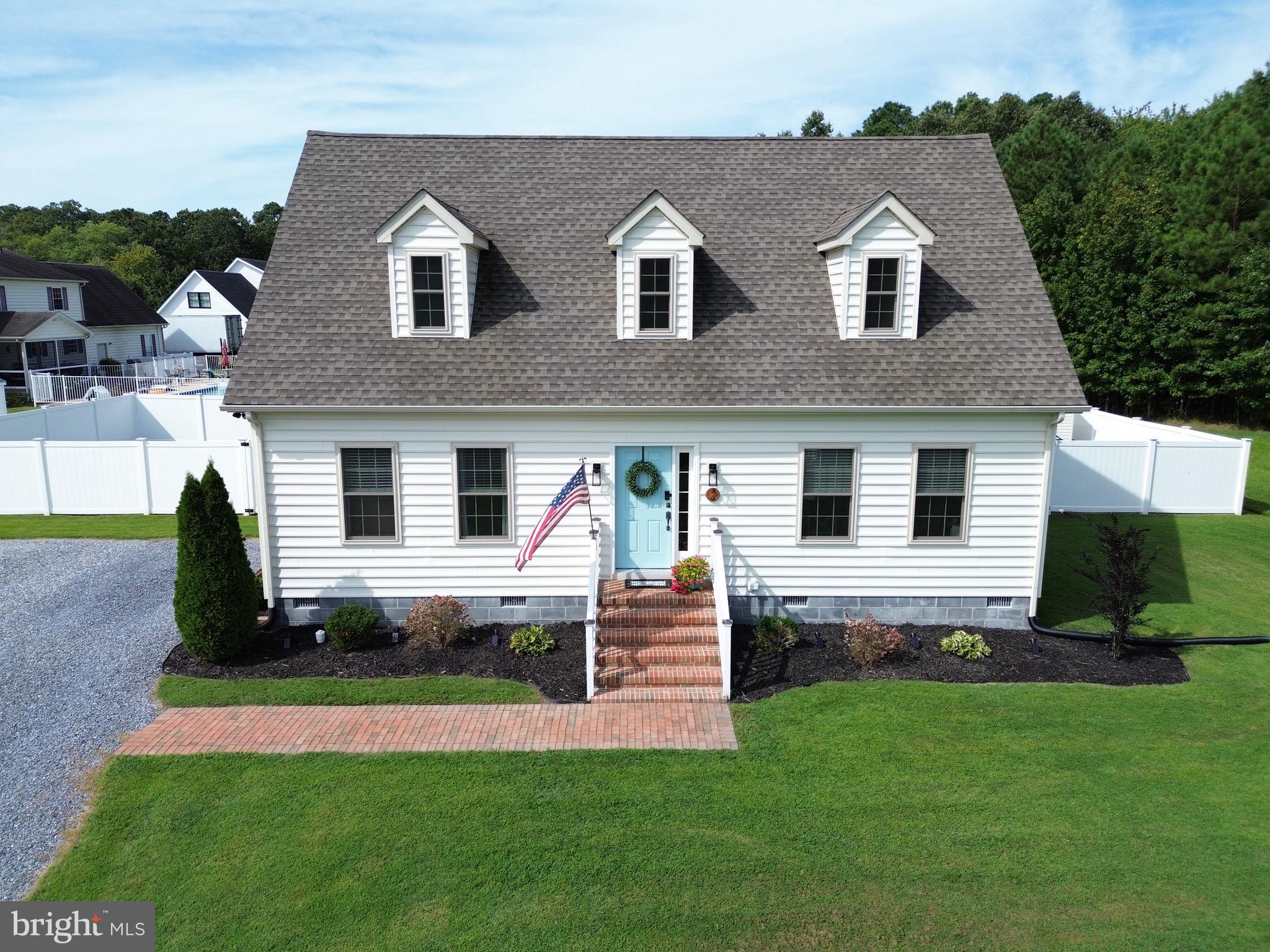 2 Arbutus Terrace Cambridge, MD 21613 - Photo 2 of 41 a front view of a house with a yard and green space