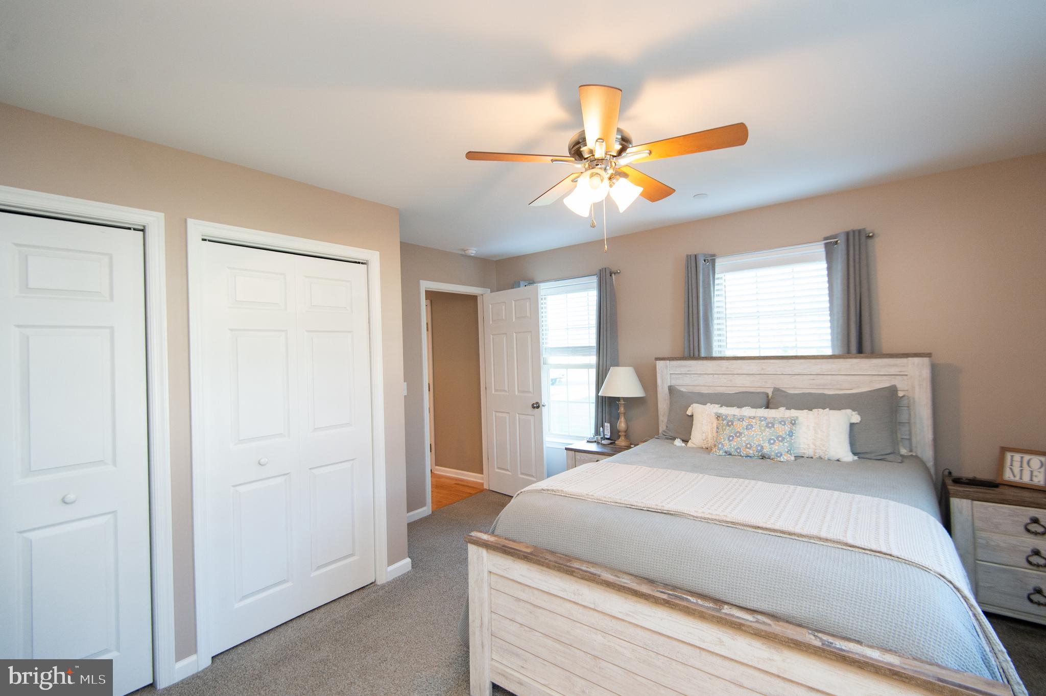 2 Arbutus Terrace Cambridge, MD 21613 - Photo 23 of 41 a bedroom with a bed and a chandelier