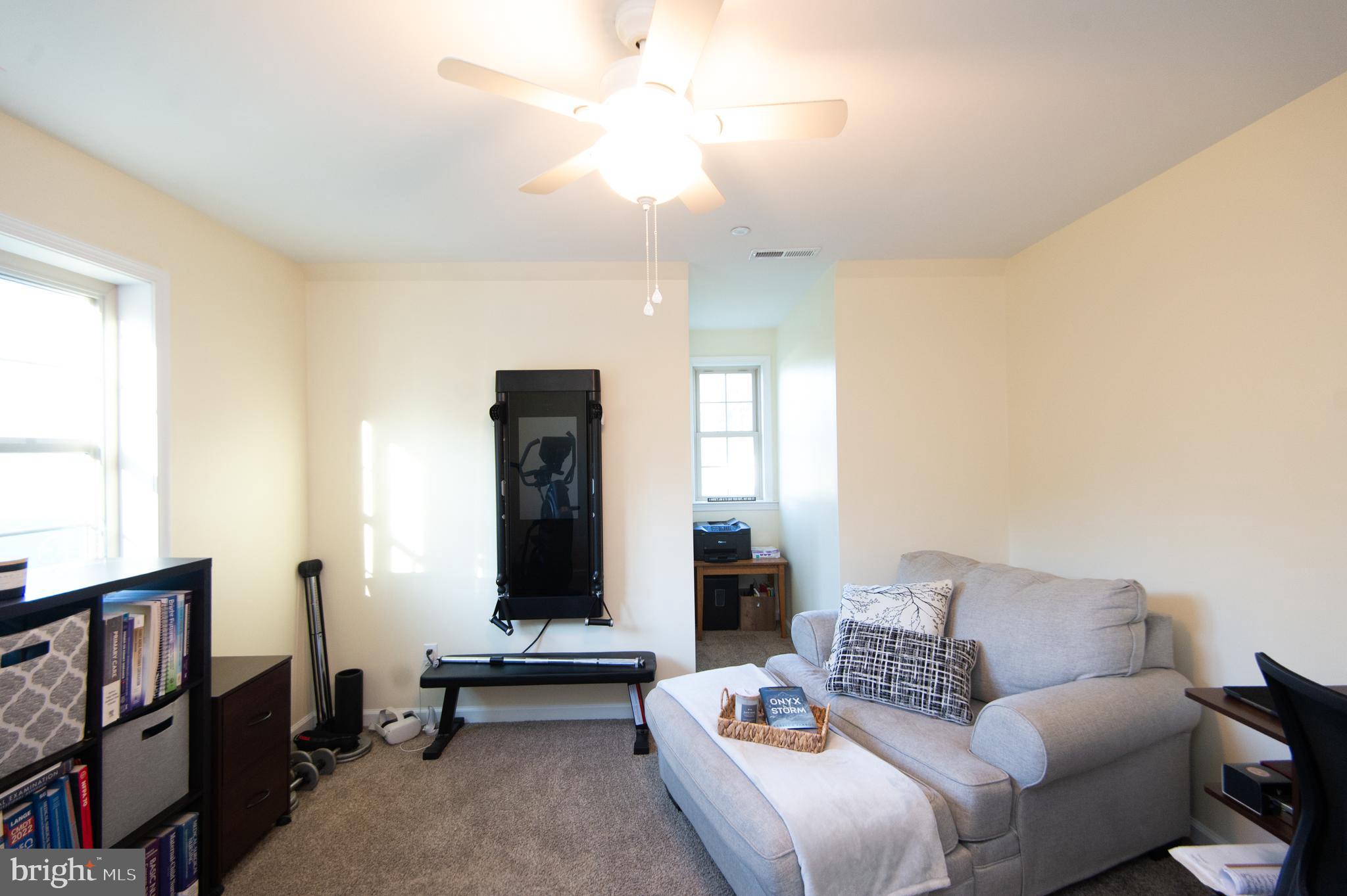 2 Arbutus Terrace Cambridge, MD 21613 - Photo 33 of 41 a living room with furniture and a window