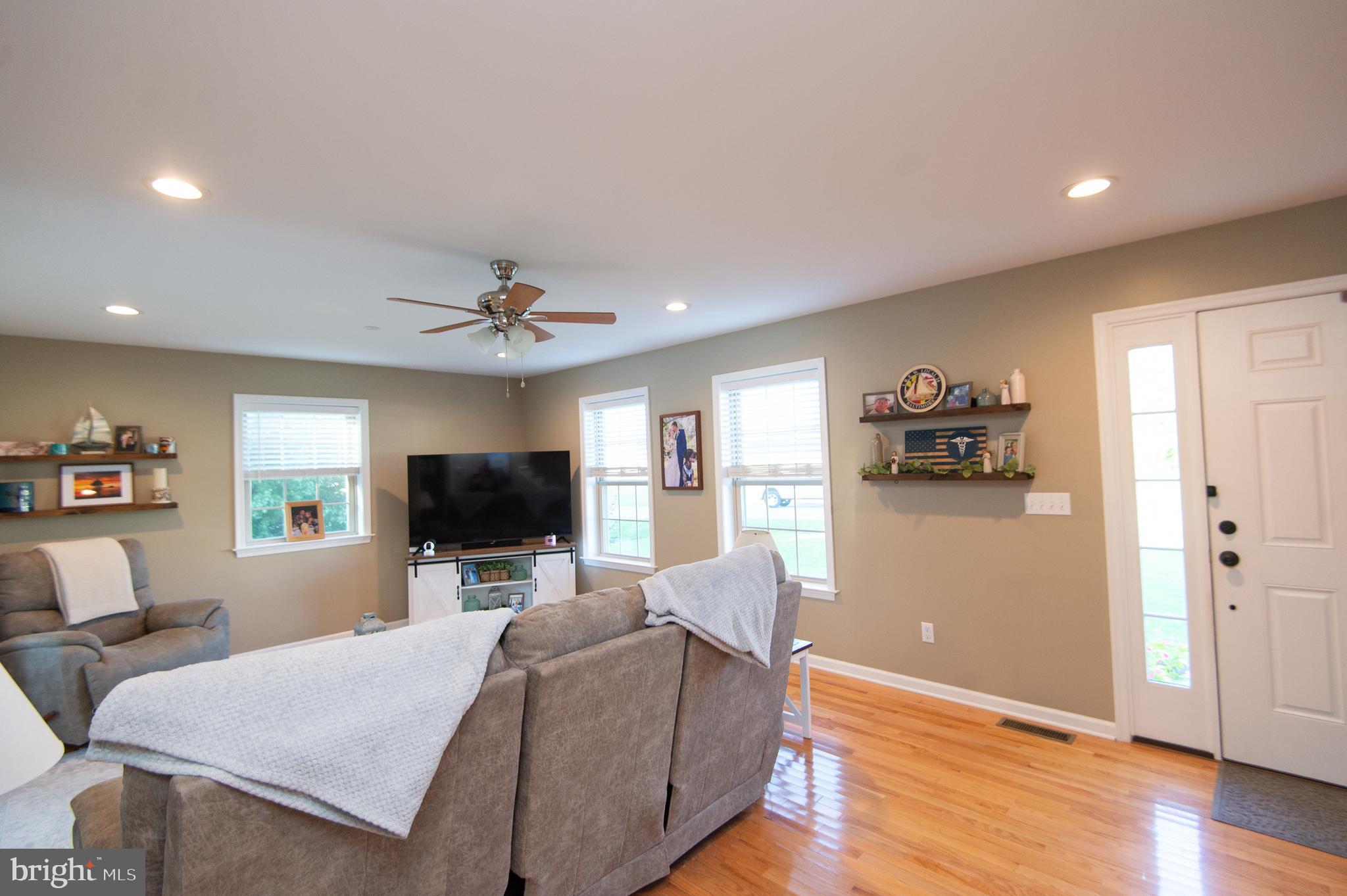 2 Arbutus Terrace Cambridge, MD 21613 - Photo 5 of 41 a living room with furniture and a flat screen tv