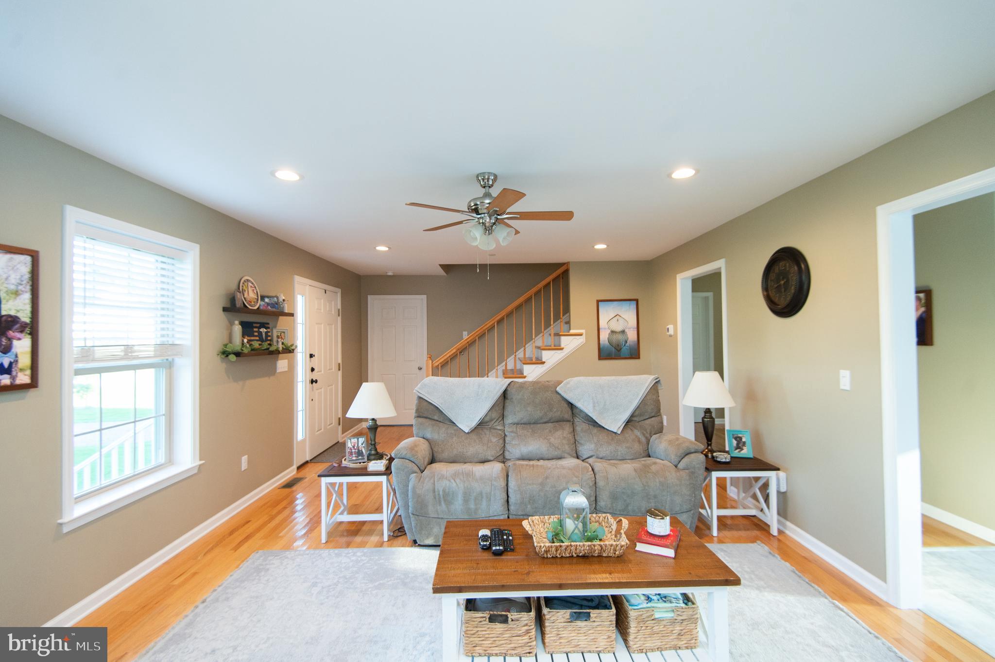 2 Arbutus Terrace Cambridge, MD 21613 - Photo 7 of 41 a living room with furniture and wooden floor