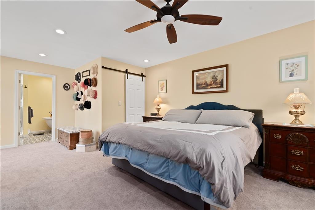 237 North Woodlawn Road Butler, PA 16001 - Photo 15 of 37 a spacious bedroom with a bed and ceiling fan