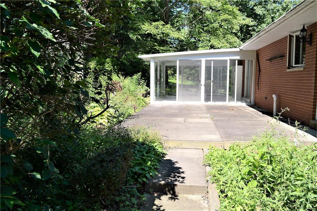 313 Woodcroft Road Economy, PA 15005 - Photo 6 of 23 back of house with sunroom