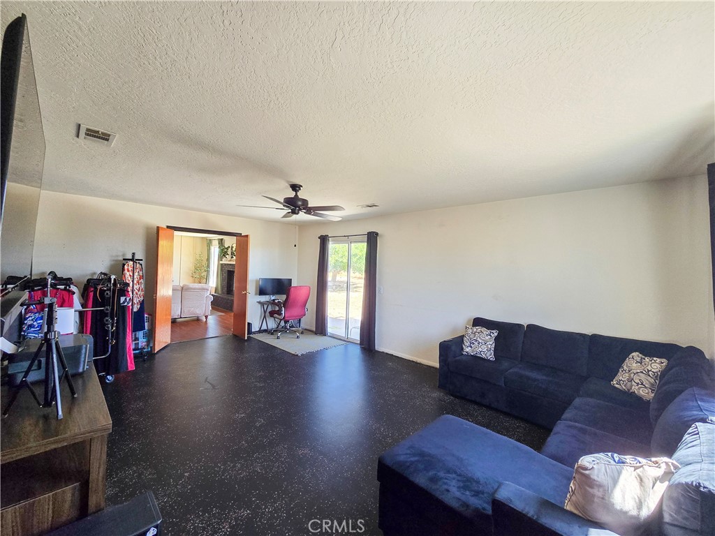 9995 Smoke Tree Road Hesperia, CA 92344 - Photo 39 of 74 a living room with furniture and wooden floor