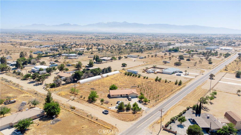 9995 Smoke Tree Road Hesperia, CA 92344 - Photo 43 of 74 an aerial view of residential houses with outdoor space