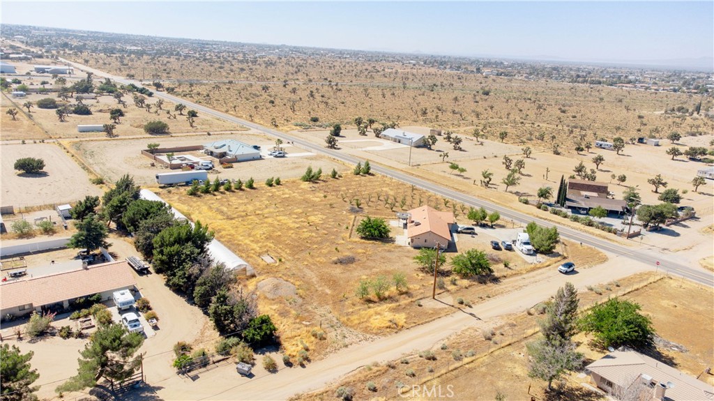 9995 Smoke Tree Road Hesperia, CA 92344 - Photo 48 of 74 an aerial view of residential houses with outdoor space