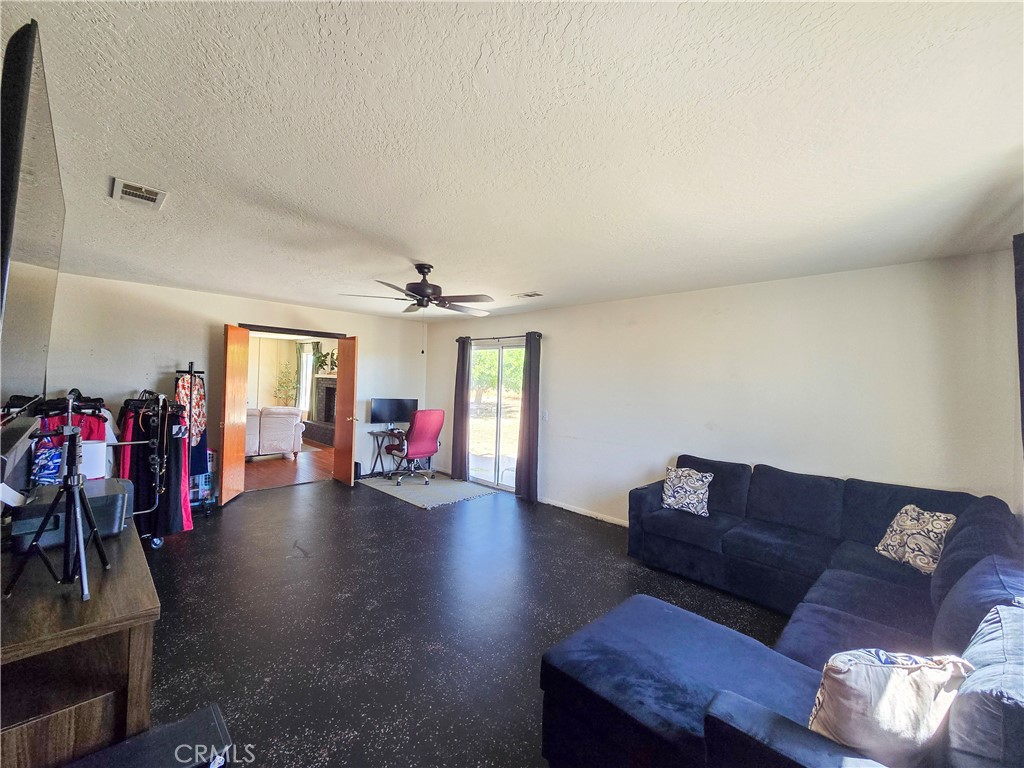 9995 Smoke Tree Road Hesperia, CA 92344 - Photo 57 of 74 a living room with furniture and wooden floor