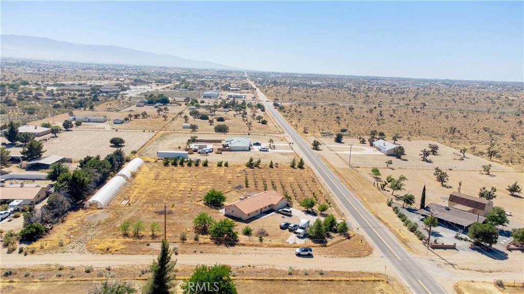 9995 Smoke Tree Road Hesperia, CA 92344 - Photo 61 of 74 an aerial view of residential houses with outdoor space