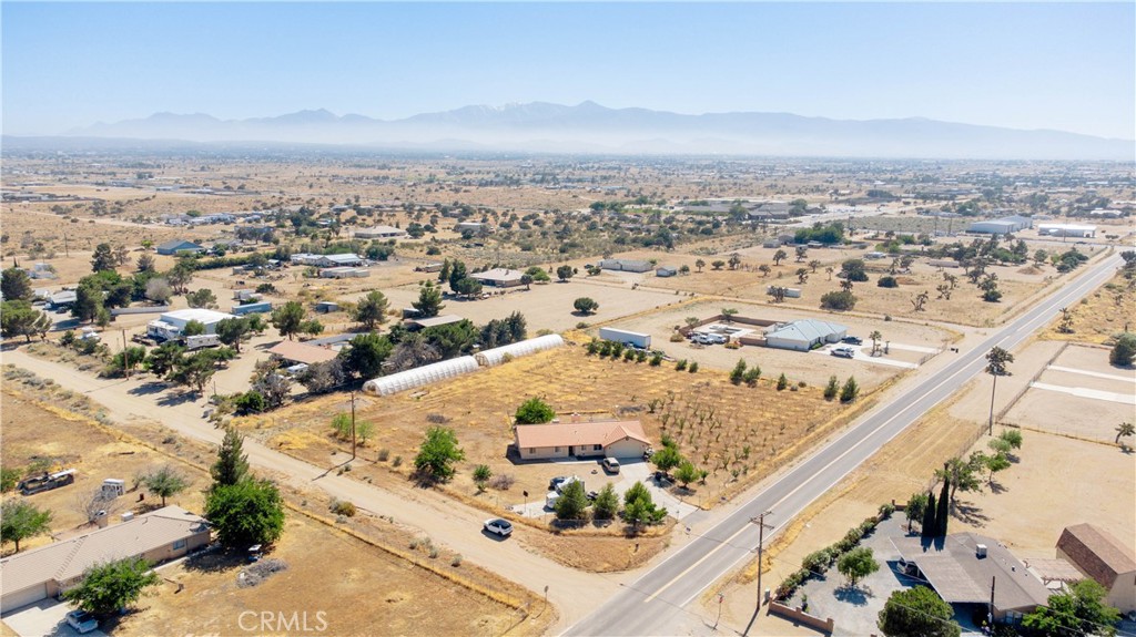 9995 Smoke Tree Road Hesperia, CA 92344 - Photo 62 of 74 an aerial view of residential houses with outdoor space