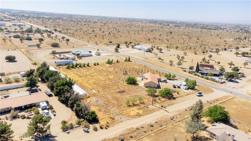 9995 Smoke Tree Road Hesperia, CA 92344 - Photo 67 of 74 an aerial view of residential houses with outdoor space