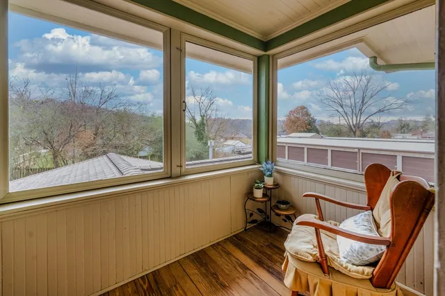 a bed room with a bed and a window
