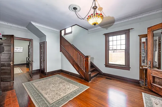 a view of an entryway with wooden floor