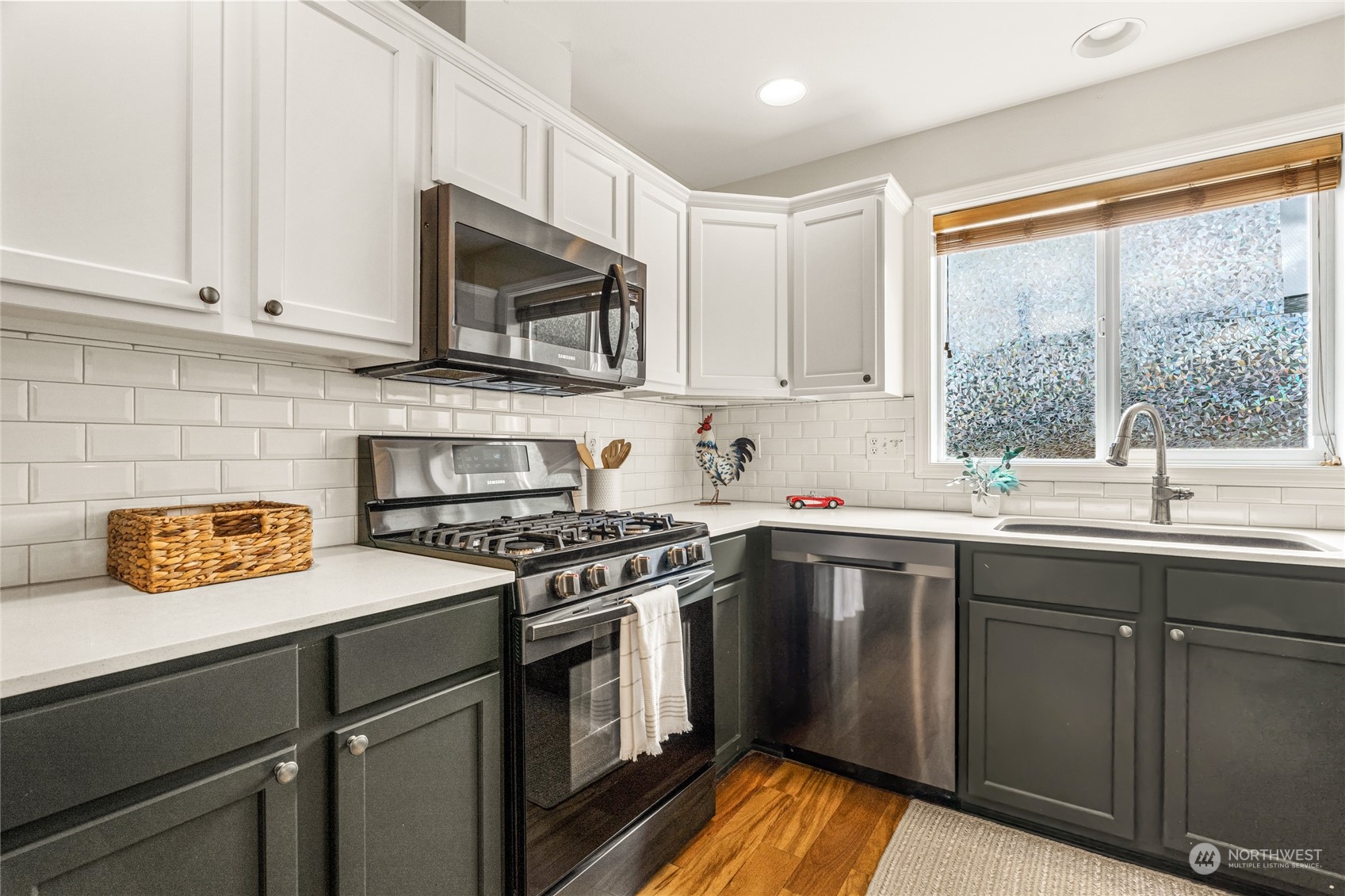 6712 Lower Ridge Road Everett, WA 98203 - Photo 11 of 34 a kitchen with stainless steel appliances granite countertop a sink a stove and a microwave