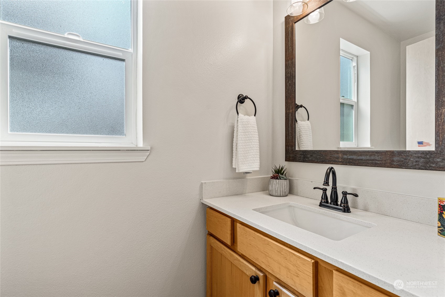 6712 Lower Ridge Road Everett, WA 98203 - Photo 19 of 34 a bathroom with a sink and a mirror
