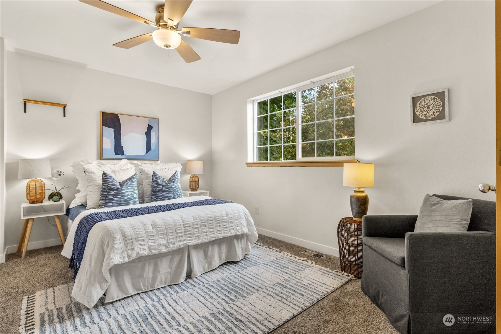 6712 Lower Ridge Road Everett, WA 98203 - Photo 22 of 34 a bedroom with a bed couch and window