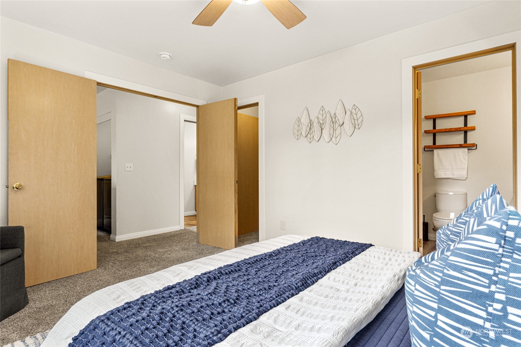 6712 Lower Ridge Road Everett, WA 98203 - Photo 24 of 34 a bedroom with a bed and wooden floor