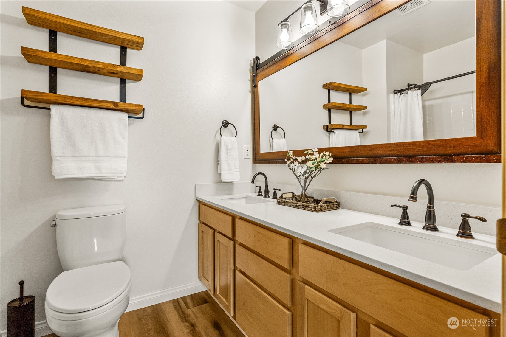 6712 Lower Ridge Road Everett, WA 98203 - Photo 25 of 34 a bathroom with a toilet sink and mirror