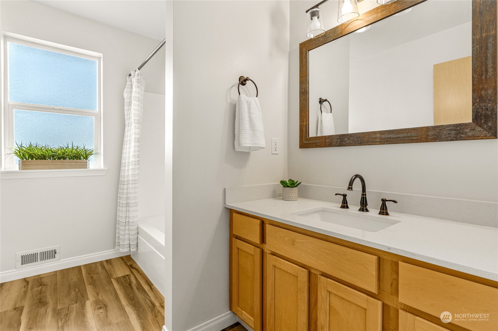 6712 Lower Ridge Road Everett, WA 98203 - Photo 28 of 34 a bathroom with a sink and a mirror