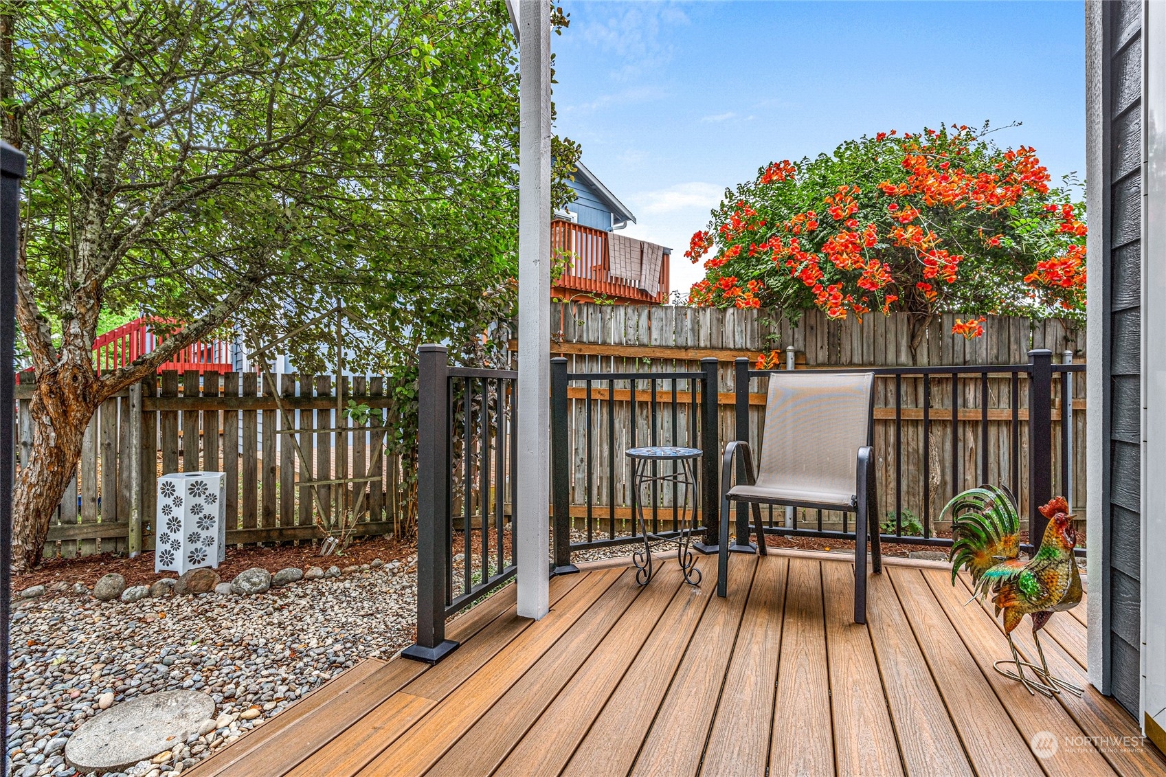 6712 Lower Ridge Road Everett, WA 98203 - Photo 3 of 34 a balcony with wooden floor table and chairs