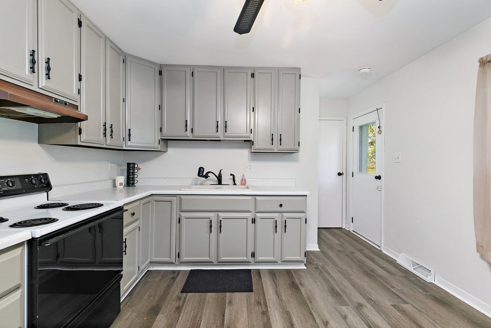 5815 Johnson Road Marengo, IL 60152 - Photo 17 of 30 a kitchen with wooden cabinets stove top oven and sink