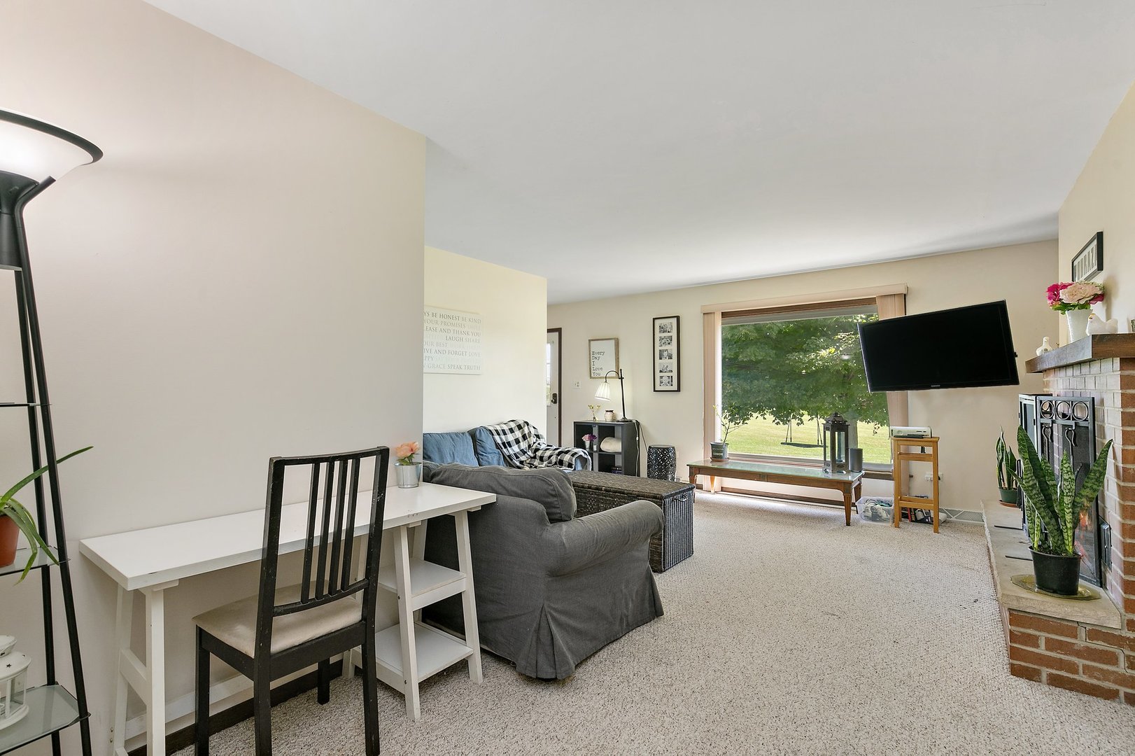5815 Johnson Road Marengo, IL 60152 - Photo 4 of 30 a living room with furniture and a flat screen tv