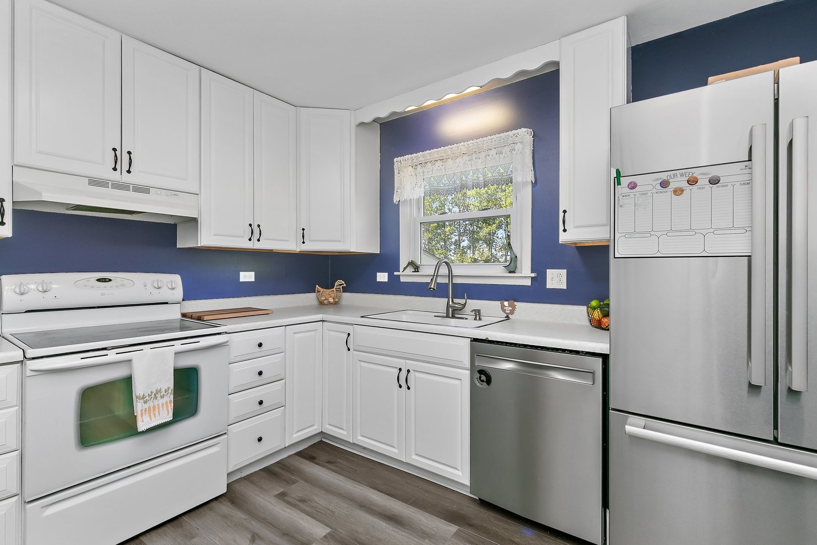 5815 Johnson Road Marengo, IL 60152 - Photo 7 of 30 a kitchen with white cabinets and white appliances