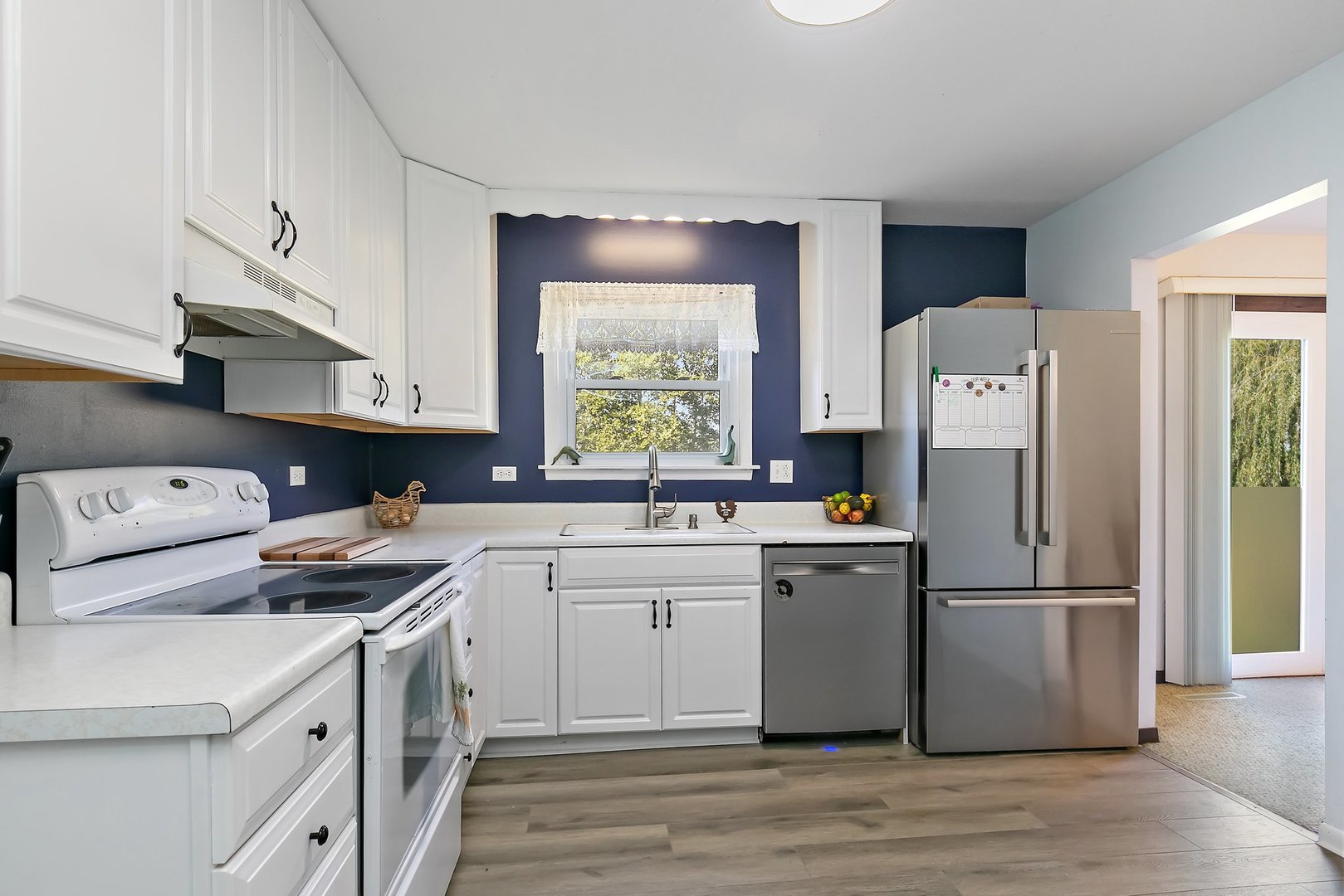 5815 Johnson Road Marengo, IL 60152 - Photo 8 of 30 a kitchen with a white cabinets and white appliances