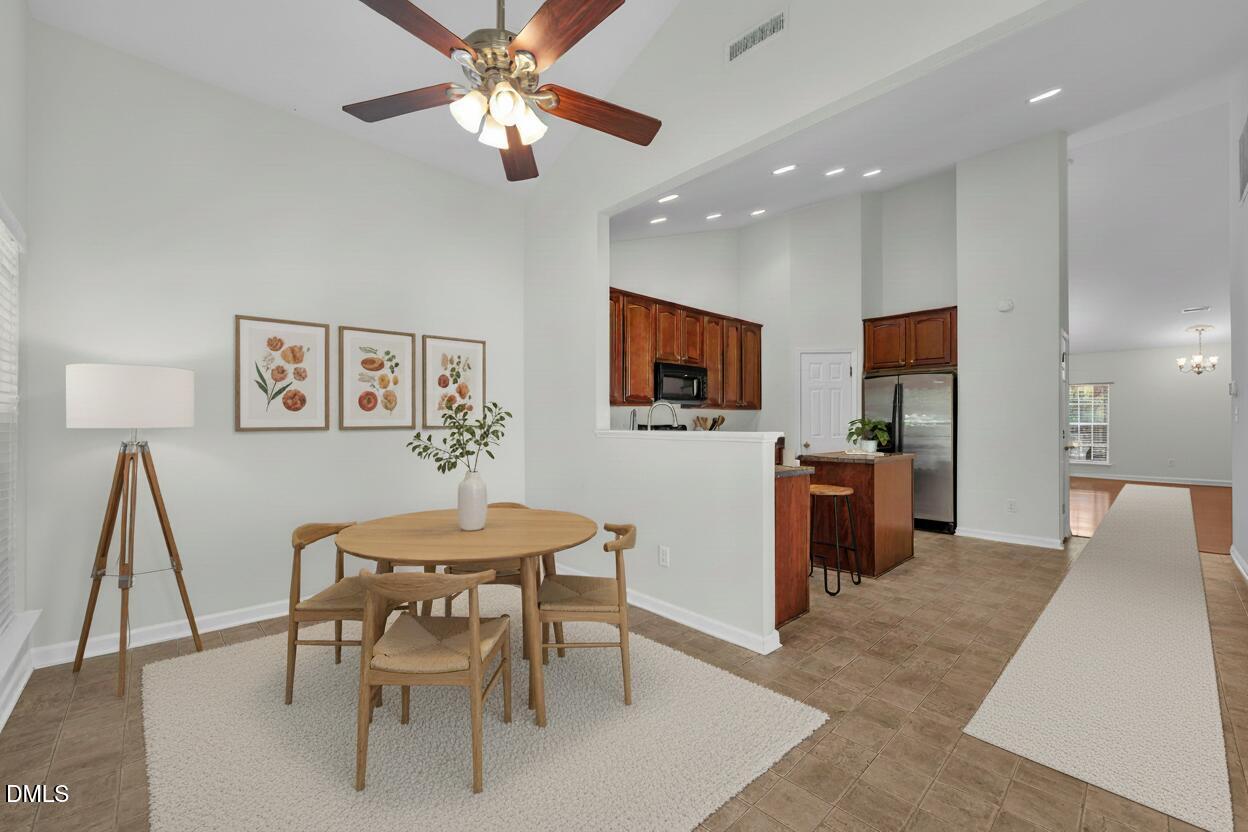 12014 Fox Valley Street Raleigh, NC 27614 - Photo 11 of 42 a view of a dining room with furniture